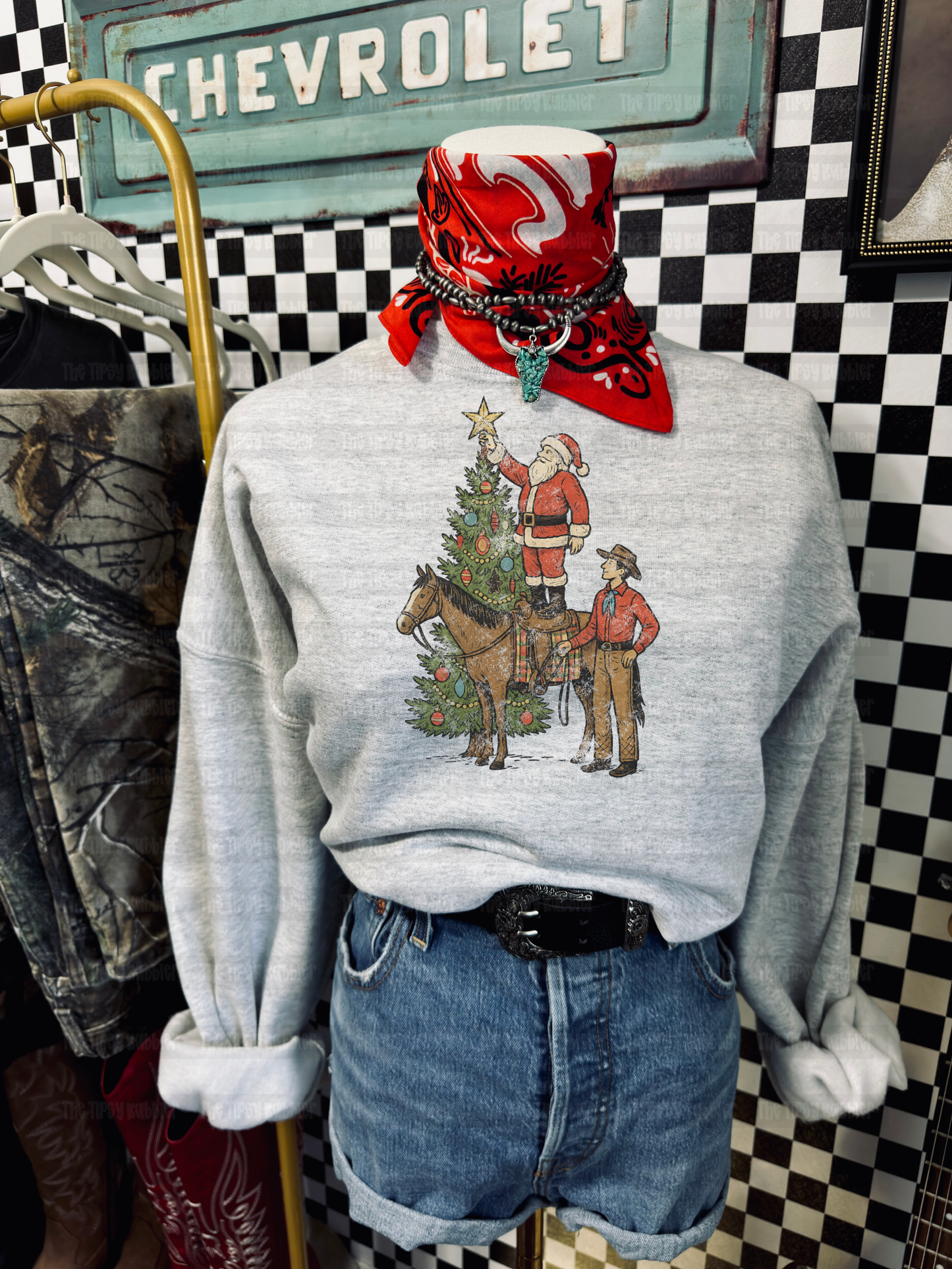 Santa putting star on tree