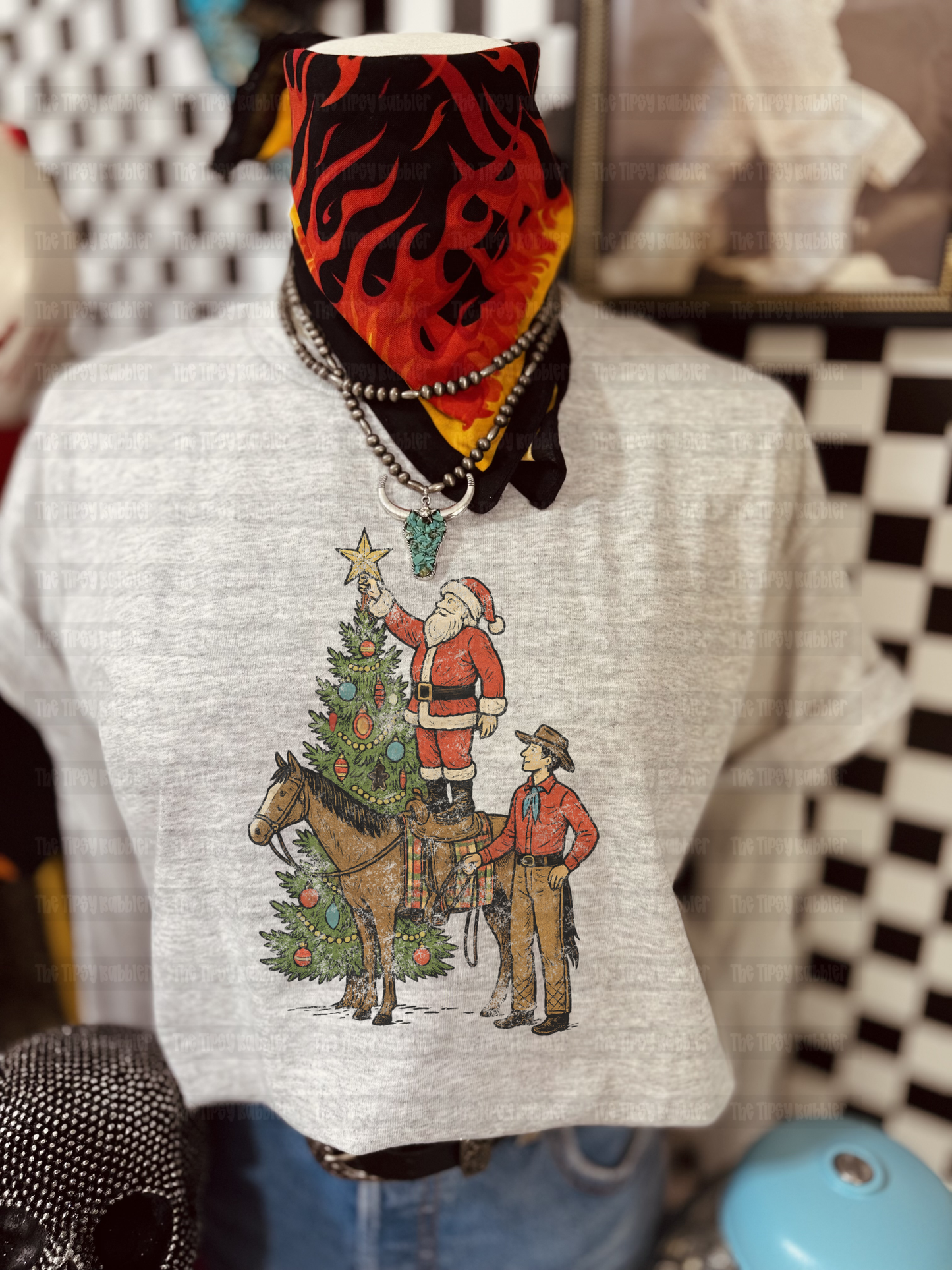 Santa putting star on tree